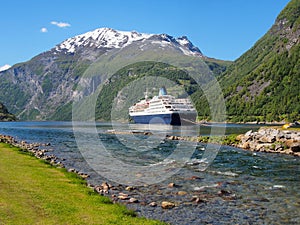 View to Geiranger fjord, cruise ship on a background of mountains, Norway