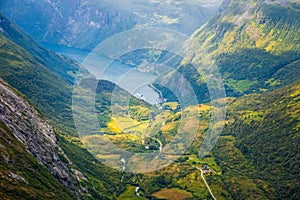 View to the Geiranger fjord with green valley surrounded by mountains, Geiranger, Sunnmore region, More og Romsdal county, Norway