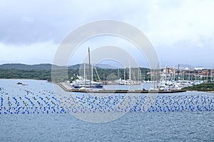 A view to the harbor of Olbia from the sea on a cloudy day, Sardinia, Italy