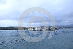 A view to the harbor of Olbia from the sea on a cloudy day, Sardinia, Italy