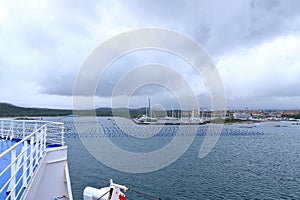 A view to the harbor of Olbia from the sea on a cloudy day, Sardinia, Italy