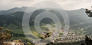 View to Hubova village with hills on the background from Havran hill in Velka Fatra mountains in Slovakia