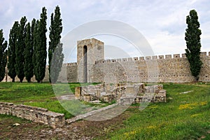 View to inner yard and ruined outer wall and towers of stone old medieval fortress Smederevo in Serbia, national landmark