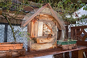 View to an insect house in the garden, protection for insects, named insect hotel, Insektenhotel.