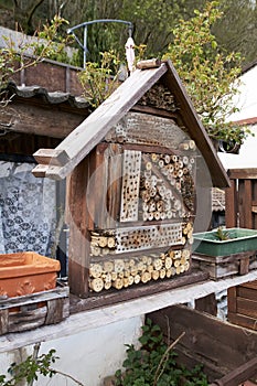 View to an insect house in the garden, protection for insects, named insect hotel, Insektenhotel.