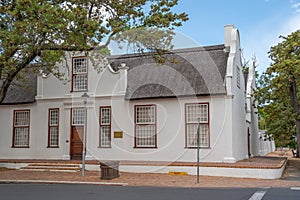 View to the Kerkhuis of Stellenbosch, typical Example of inherited Cape Dutch Architecture with blue sky