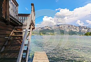 View to lake Attersee with sailing boat, Mountains of austrian alps near Salzburg, Austria Europe