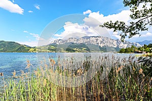 View to lake Attersee with sailing boat, Mountains of austrian alps near Salzburg, Austria Europe