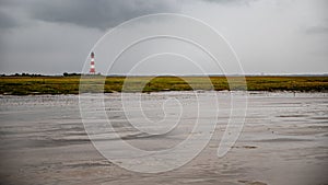 View to the lighthouse Westerheversand from Watt