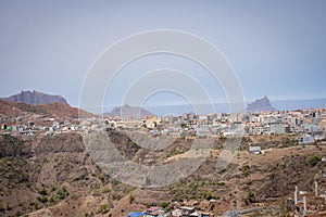 View to a lonely village with simple stone houses in a valley in the mountains in the center of Santiago Island,