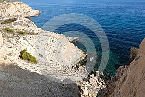 View to Mediterranean Sea and rocky little cove of Cala Fonda from the cliff path near Villajoyosa. La Vila Joiosa - photo