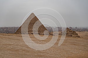 View to Menkaure pyramid and pyramids of the Queen`s. Giza plateau, Egypt