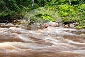 view to the Mountain river with Flowing Water Stream and sandstone cliffs