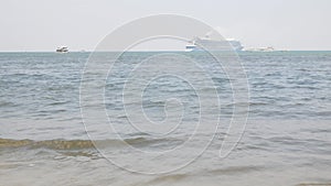 view to the ocean sea with giant cruise ship in the sea and some small ship,speedboat and jet ski water outdoor activity under