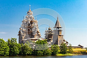 View to old monastery Kizhi Pogost, wooden Temple and Churchyard. Church of Transfiguration, bell tower in summer at