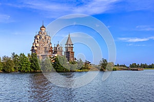 View to old monastery Kizhi Pogost, wooden Temple and Churchyard. Church of Transfiguration, bell tower in summer at