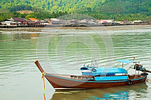 View to old wooden Old Town houses, long tail boat, Koh Lanta, Krabi, Thailand