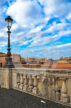 View to the roofs of Rome, Italy with street light