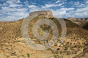 View to the rural surroundings and the hill, on top of which the famous 6-th century Ethiopian Debre Damo Monastery is located in