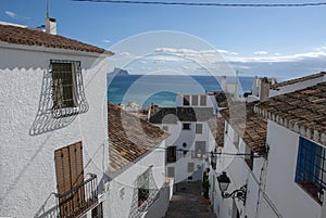 View to the sea in lane with typical white spanish houses in Altea, Costa Blanca