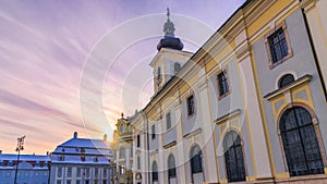 View to the Sibiu Big square and a chatolic church at sunset in Sibiu, Romania