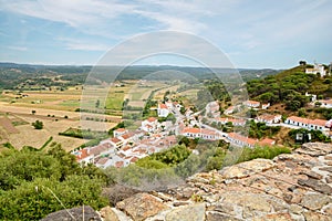 View to small town of Aljezur with traditional portuguese houses and rural landscape, Algarve Portugal