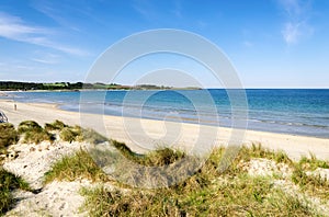 A view to Sola beach from the grass covered sand dunes