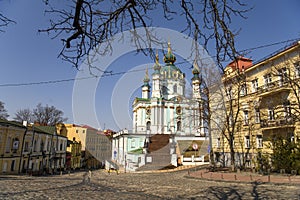 View to St. Andrew Church and Andriyivskyy Uzviz Descent Street in Kyiv, Ukraine. March 2022