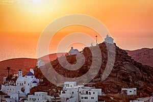 View to tha famous churches above the town of Ios island, Greece, during sunset