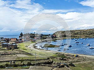 View to Titicaca lake at Isla del Sol with small village Yumani