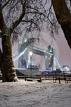 View to the Tower Bridge on a winter night with snow, London