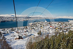 View to the Tromso city from the Fjellheisen aerial tramway cabin in Tromso, Norway.