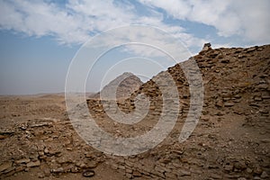 View to Userkaf pyramid from ruins near step pyramid of Djoser.  Archeological remain in the Saqqara necropolis, Egypt