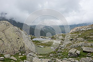 View to valley Bors from mountain slope with litile pond , Alagna Valsesia area, photo