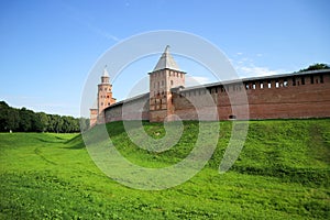 View to the wall and towers of the Velikiy Great Novgorod citadel kremlin, detinets in Russia under blue summer sky in the mor