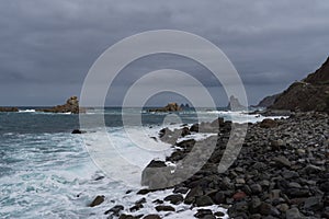 View to waves and Los Galiones cliff near Roque de Las Bodegas beach in the area of Taganana, Tenerife Island,  Spain photo
