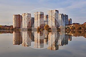 View to the west of Krasnodar from the Kuban River in the winter at golden hours. New high-rise buildings and their reflection in