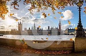 View to Westminster Palace and Big Ben tower in London, UK, during golden autumn time