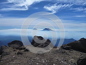 View of tolhuaca and lonquimay volcano peaks from sierra nevada in chile