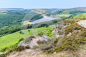 A view from top of Bamford Edge towards the wooded shore of Ladybower reservoir, UK