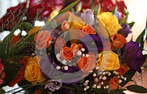 View from the top on a beautiful bouquet of orange and yellow Roses flowers.