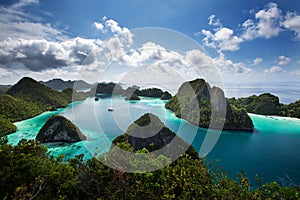 View from the top of the cliff at remote archipelago Pulau Wayag, Raja Ampat, Indonesia