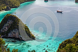 View from the top of the cliff at remote archipelago Pulau Wayag, Raja Ampat, Indonesia