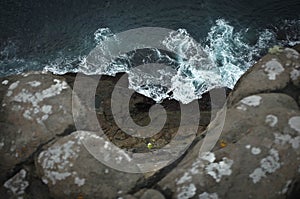 Dramatic view on the edge of cliff on Faroe Islands photo