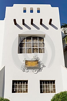 The view of top floor of house in the tropical garden with balcony and roof