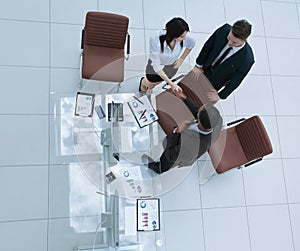 View from the top.the handshake business partners at a business meeting