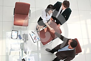 View from the top.the handshake business partners at a business meeting