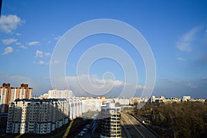 View from the top of a large open car parking and indoor multi-level parking in a residential area of the big city