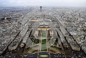 View from the top level of the Eiffel Tower, down the Champ de Mars, with the Tour Montparnasse in rainy day, Paris, Fra