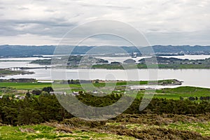 A view from top of Mastravarden hill on Mosteroy to islands and bridges in Byfjorden fjord near Randaberg